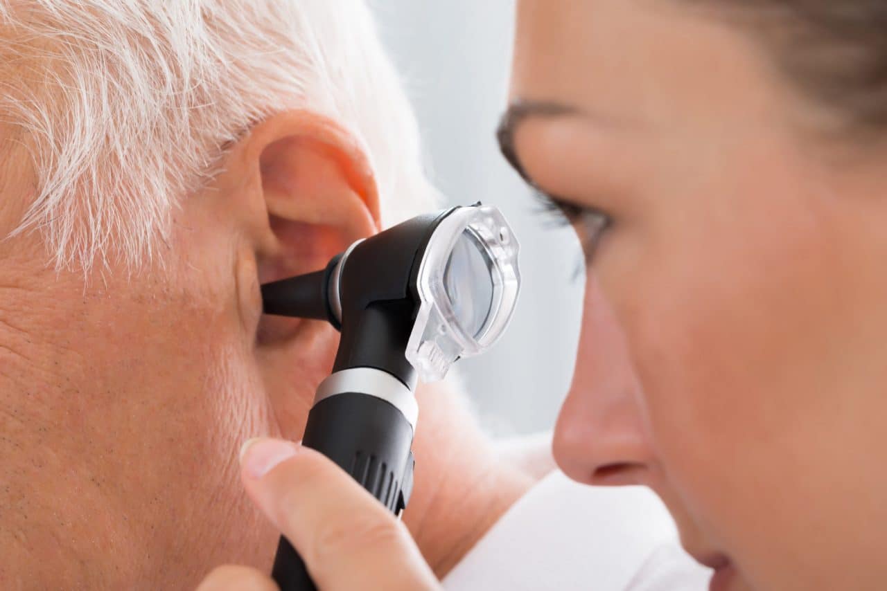 A patient having an otoscope examination
