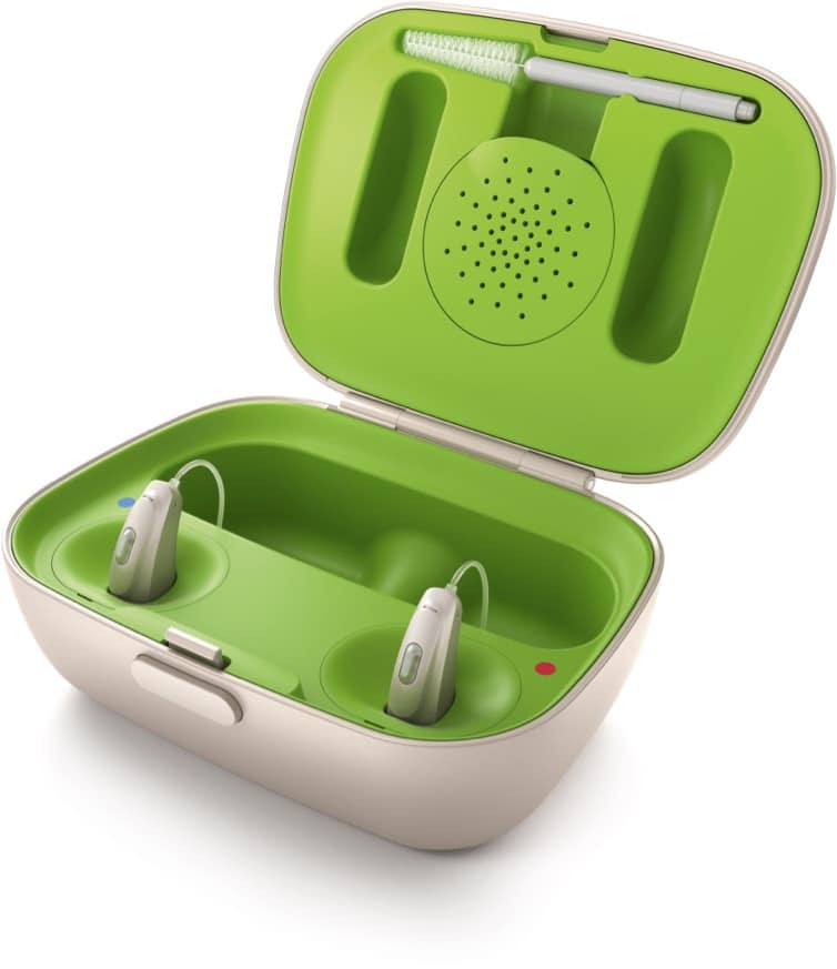 Hearing aids in a charging cradle